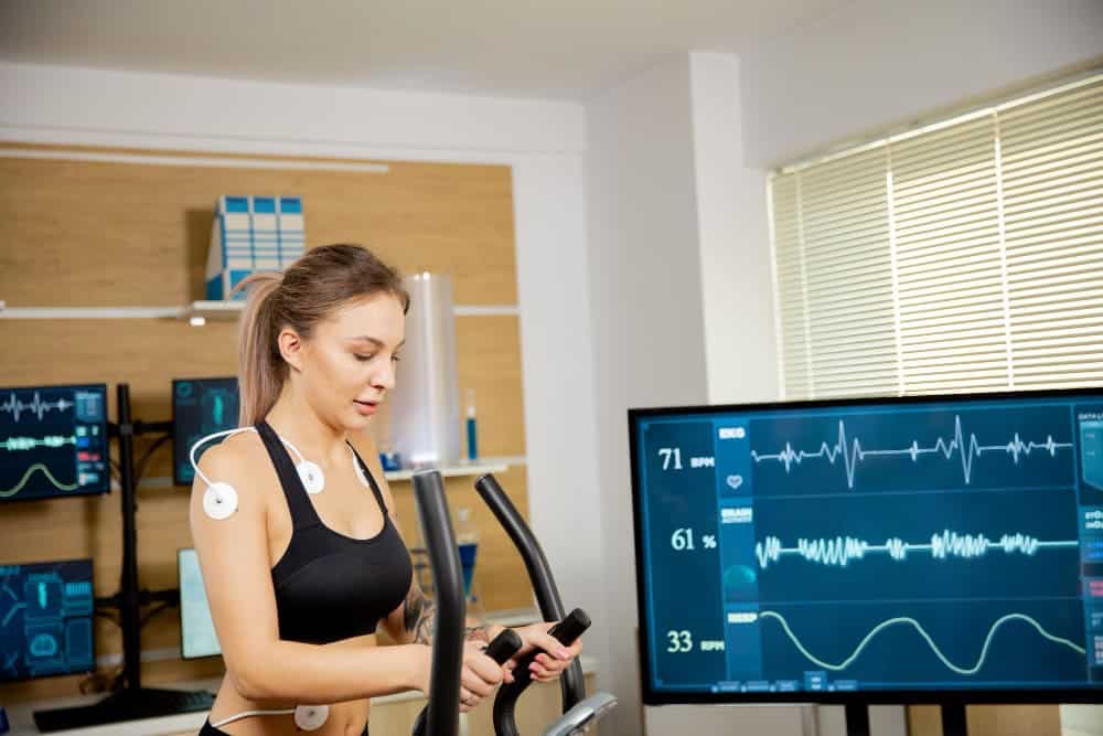 woman performing an exercise ECG (treadmill or stress test)