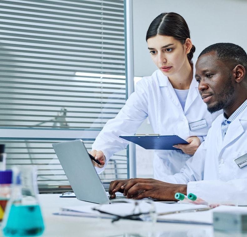 Doctors discussing CardioClin EMCR score patient data report