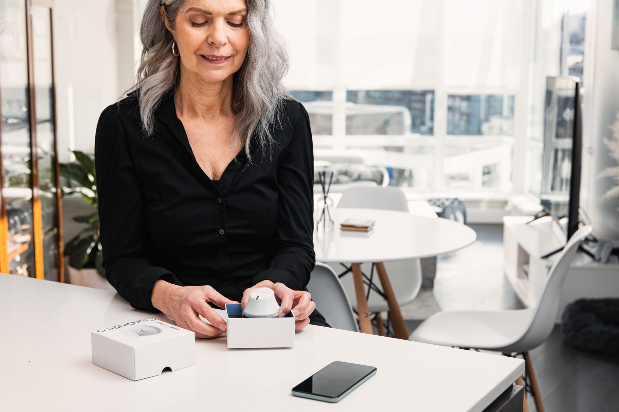 woman with CardioPro device in office