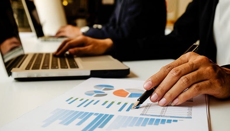 business professional looking at graphs and charts